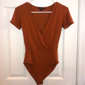Crossed body suits